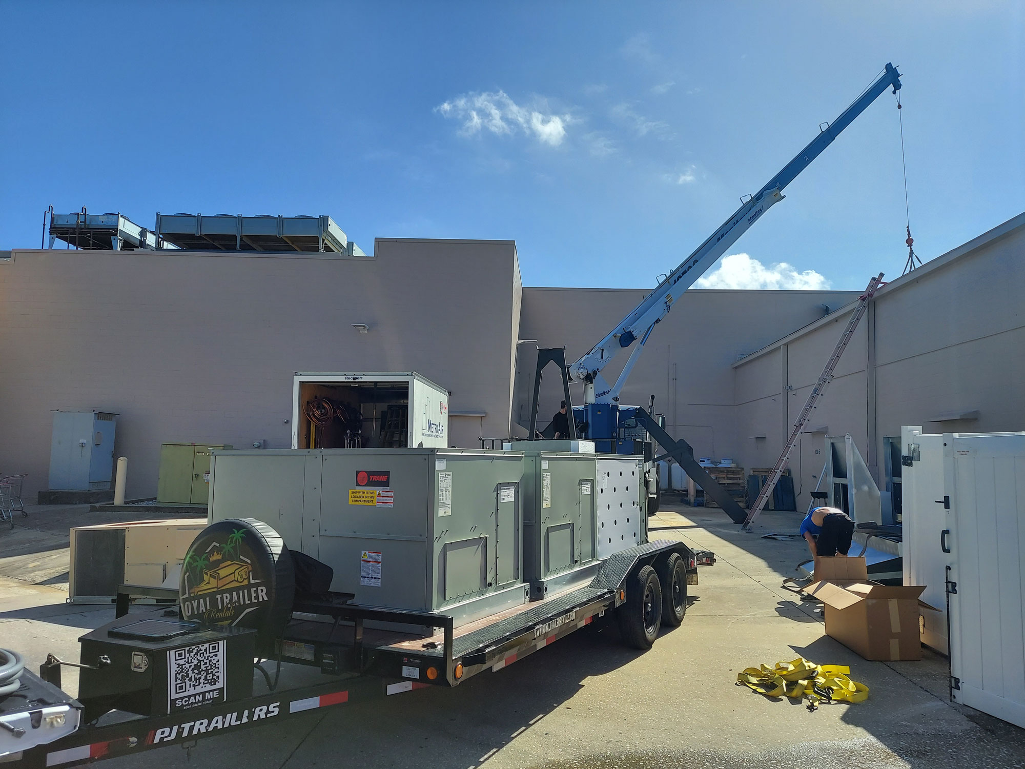 Metro Air commercial AC installation with crane