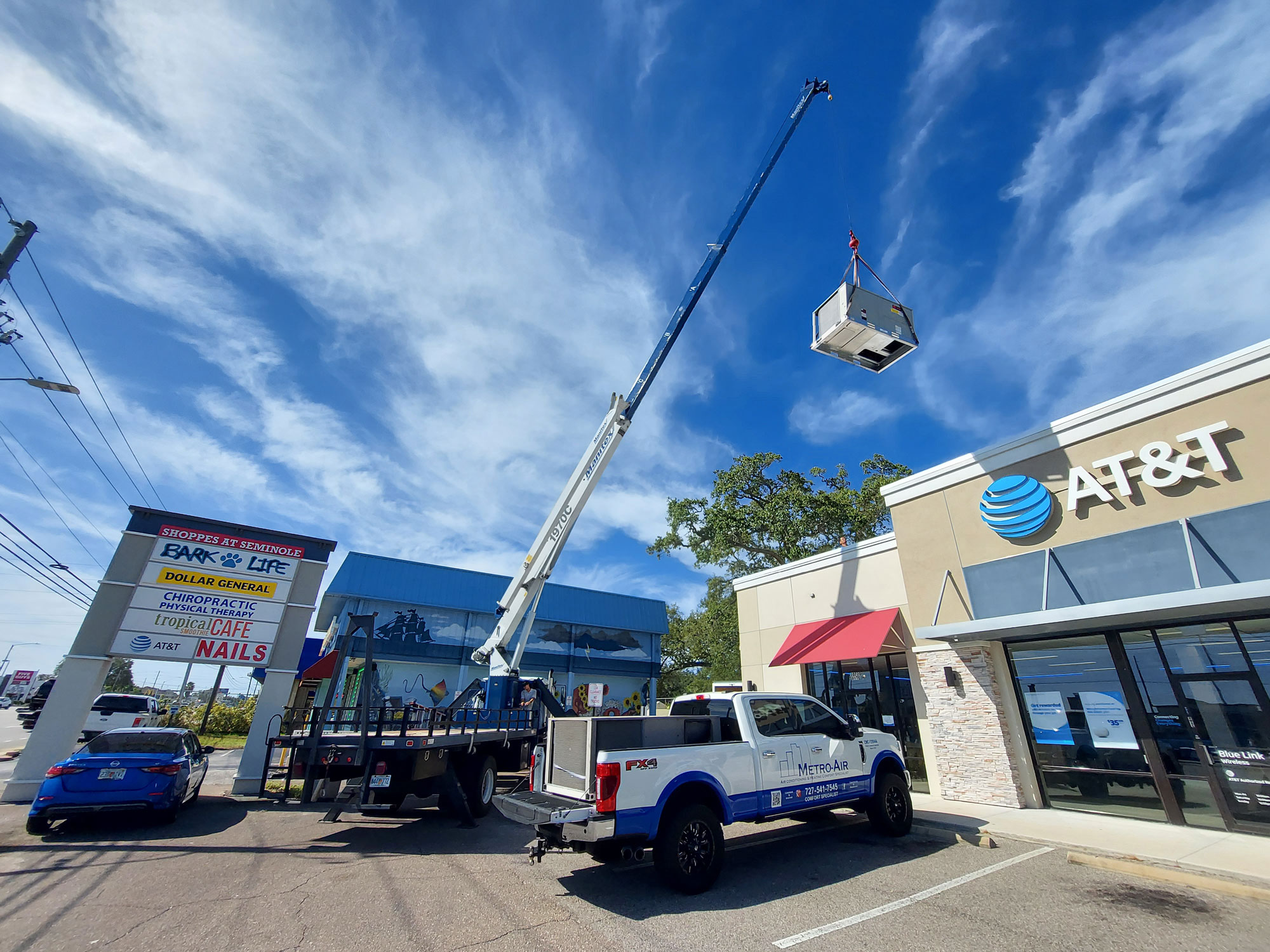 Metro Air commercial AC installation with crane